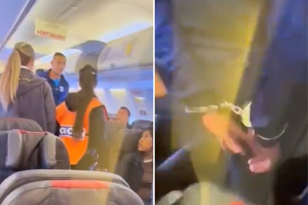 Futbolista siendo escoltado por seguridad aeroportuaria en el aeropuerto de Jujuy.